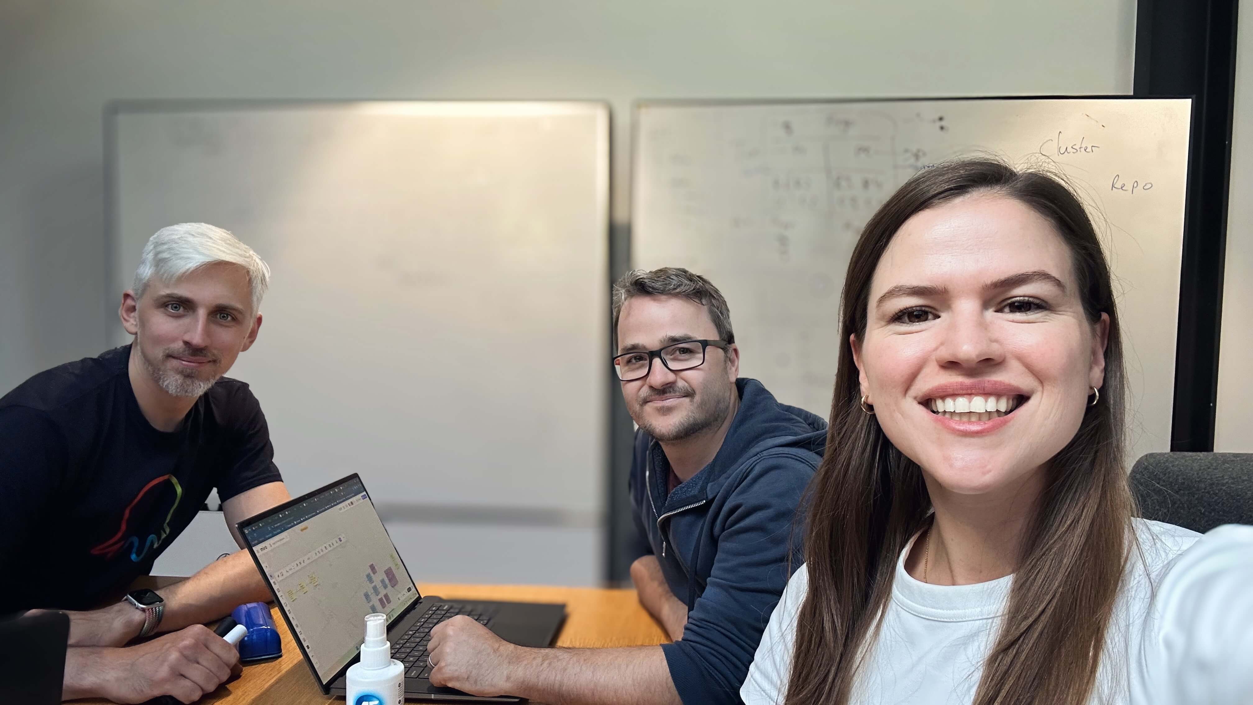 Three Octonauts sitting in front of a whiteboard.