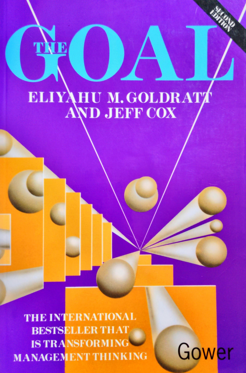 The Goal cover features a picture of Eli Goldratt and a selection of endorsements