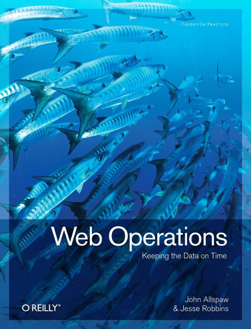 Web Operations cover features a battery of barracuda in a deep turquoise and blue ocean
